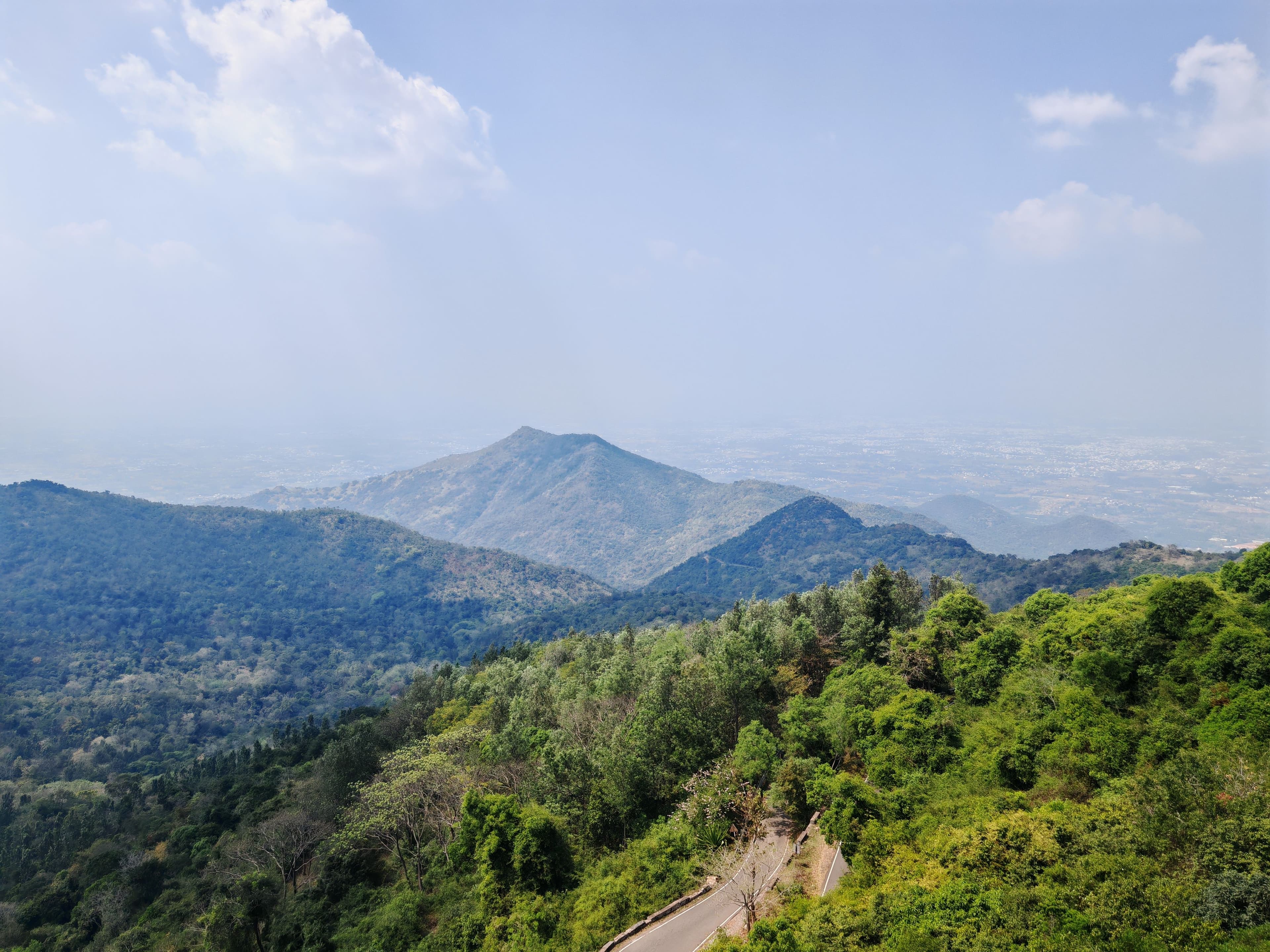 Misty forested ridgelines of the Western Ghats near Deccan Resort